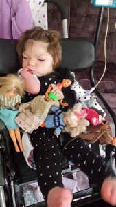 Playing barbies with her sister